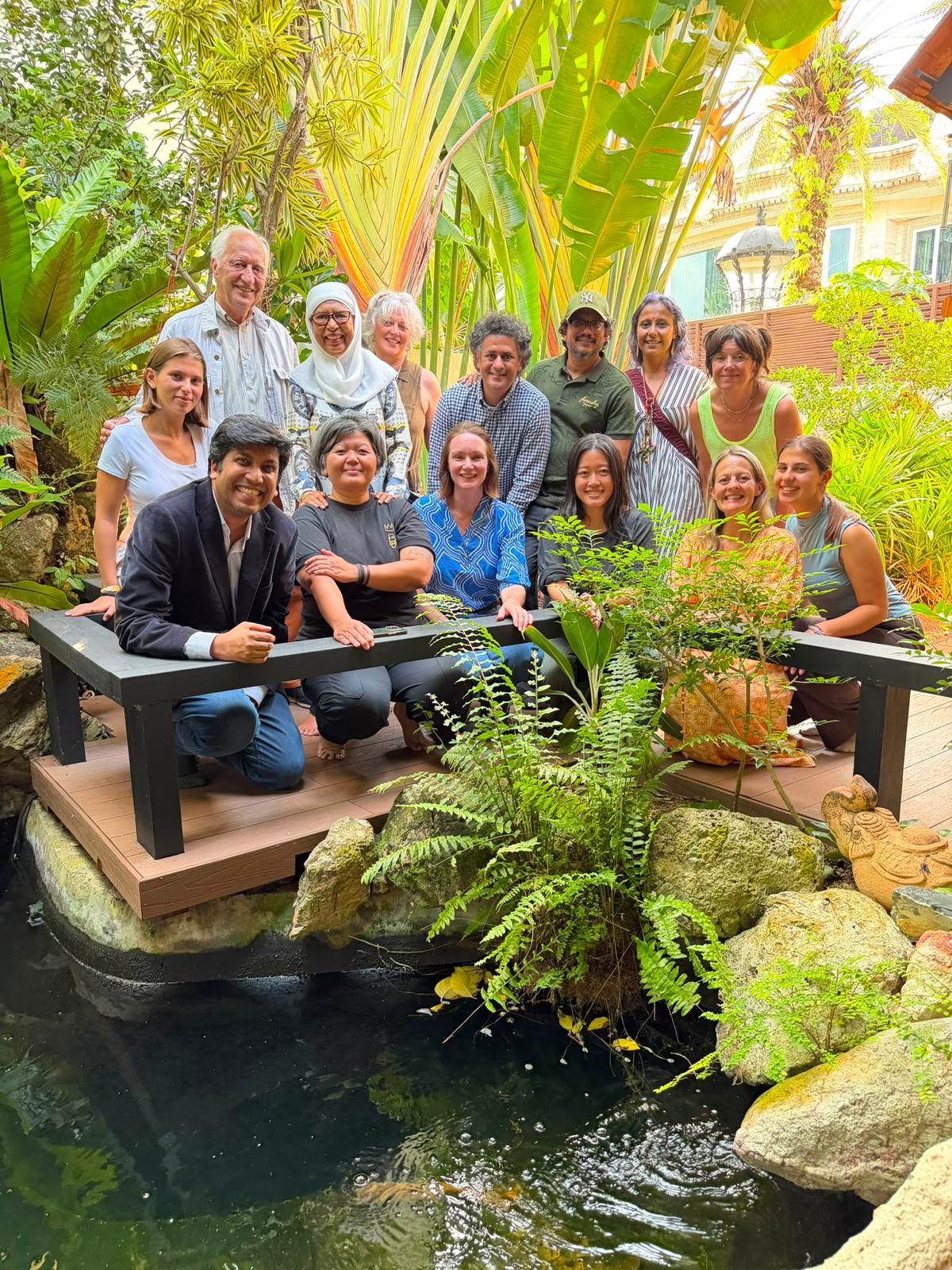 Creators in Residence and speakers from The Art of Citymaking festival, gathered in a garden courtyard