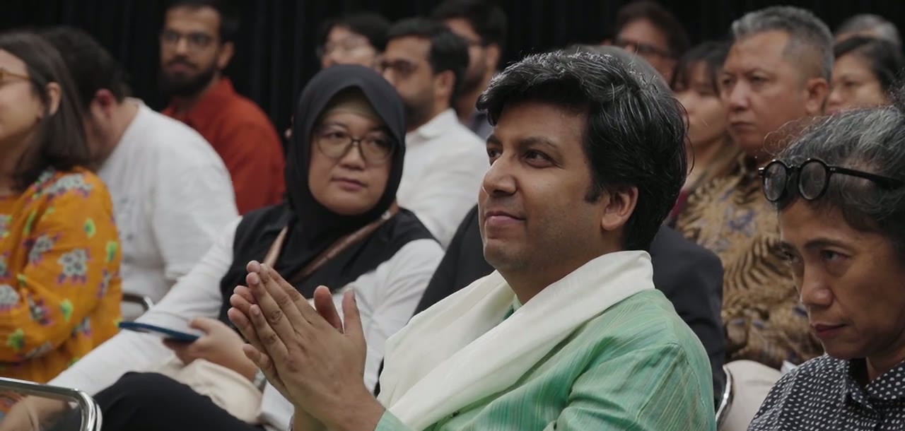 Audience members applauding